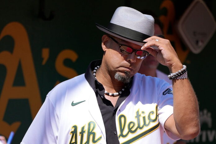 Former Major Leaguer and Oakland Athletics David Justice looks on from the dugout prior to introduction during a reunion of players on the 20-game win streak team from 2002 before to the start of the game against the New York Yankees at RingCentral Coliseum on August 28, 2022 in Oakland, California.