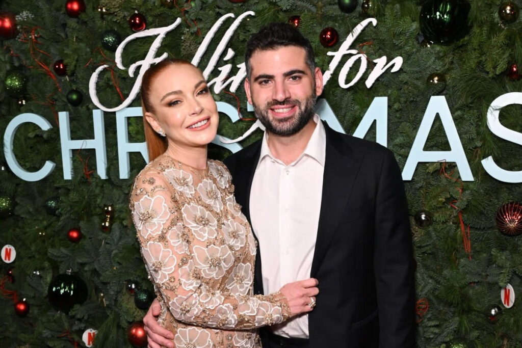 Lindsay Lohan and Bader Shammas attend Netflix’s Falling For Christmas Celebratory Holiday Fan.